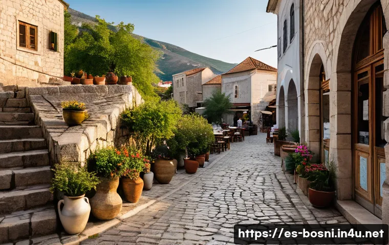 모스타르 올드타운 여행 팁 - A charming narrow cobblestone street in Mostar&rsquo;s old town, bathed in warm morning sunlight. Traditio...